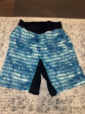 lululemon teal and blue striped running shorts with black liner